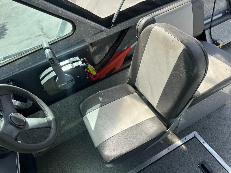 Slide: The Image of 2017 Smoker Craft 182 Phantom boat interior with steering wheel and seat. - 26