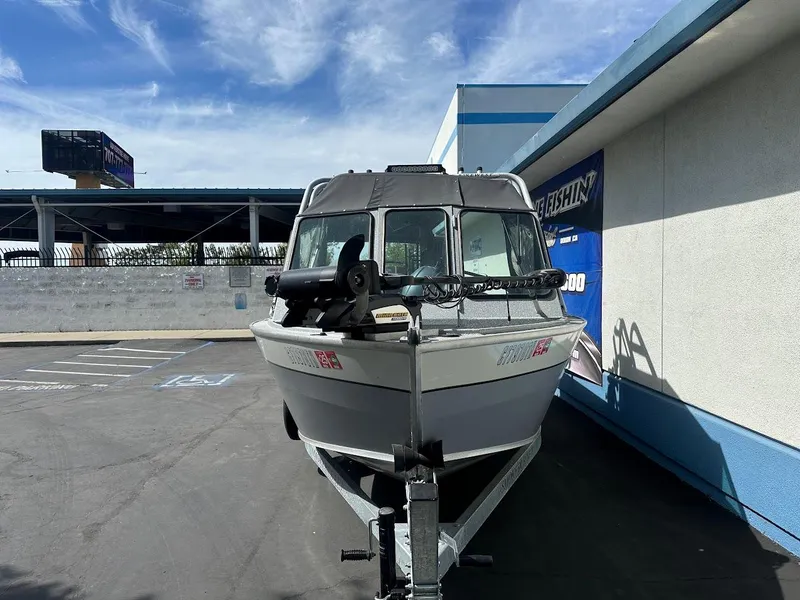 Slide: The Image of 2017 Smoker Craft 182 Phantom boat on trailer in parking lot. - 3