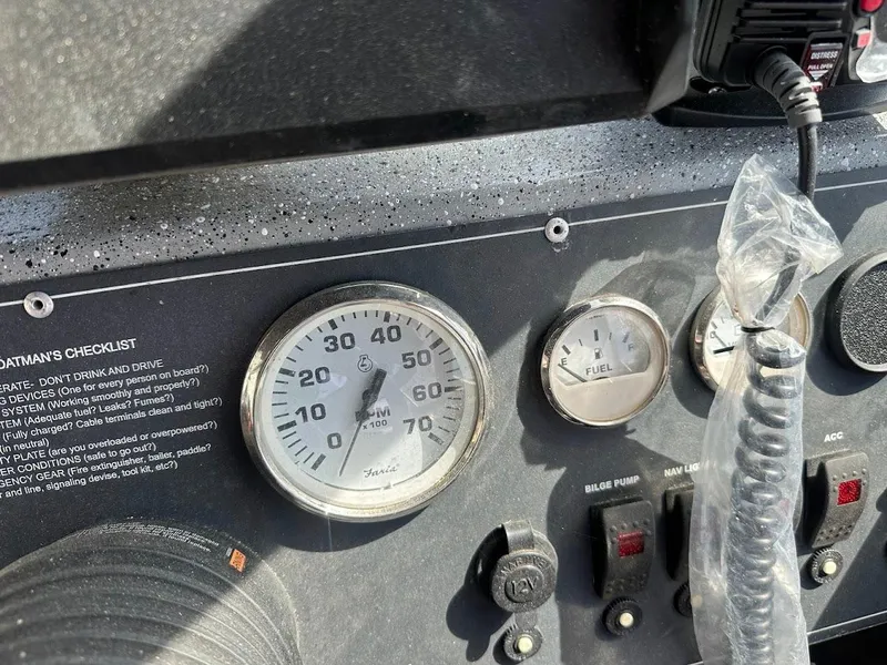Slide: The Image of Dashboard of 2017 Smoker Craft 182 Phantom boat with gauges and controls. - 32
