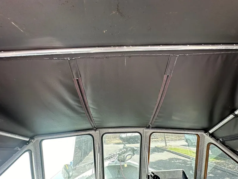 Slide: The Image of Interior view of 2017 Smoker Craft 182 Phantom boat canopy. - 34