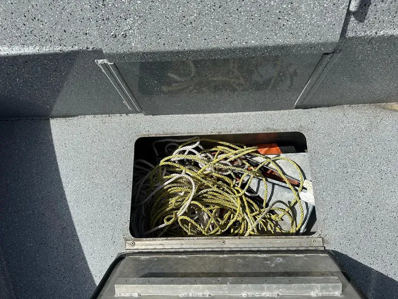 Slide: The Image of Storage compartment in 2017 Smoker Craft 182 Phantom boat with ropes and equipment. - 37