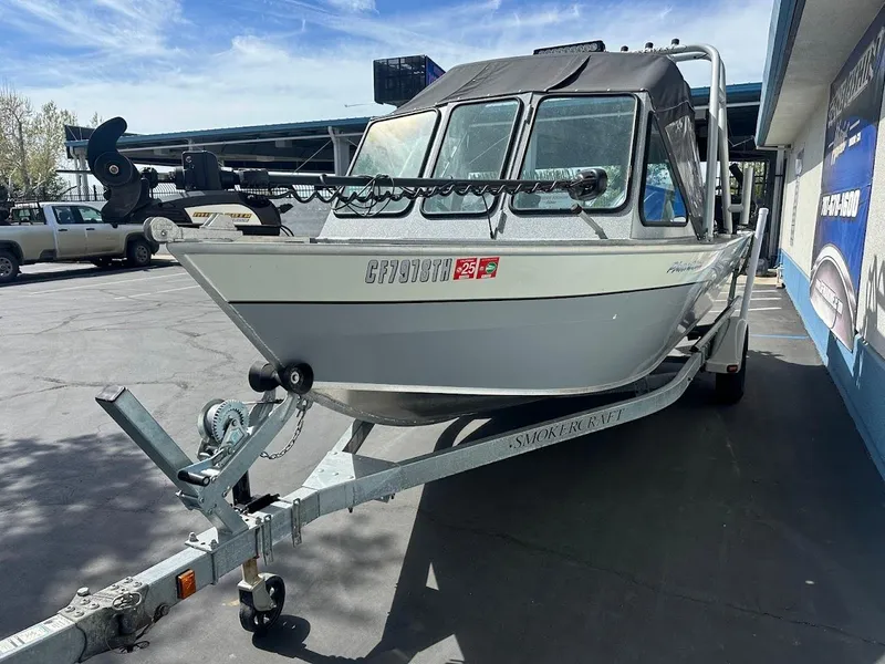 Slide: The Image of 2017 Smoker Craft 182 Phantom boat on trailer, parked outdoors. - 4