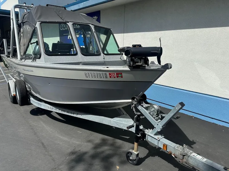 Slide: The Image of 2017 Smoker Craft 182 Phantom boat on trailer, parked outdoors. - 6