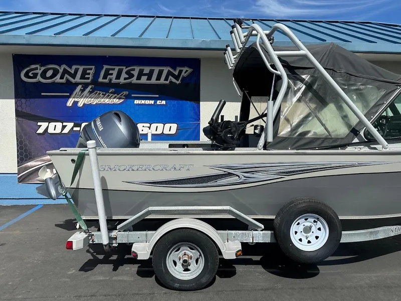 Slide: The Image of 2017 Smoker Craft 182 Phantom boat on trailer outside dealership. - 9