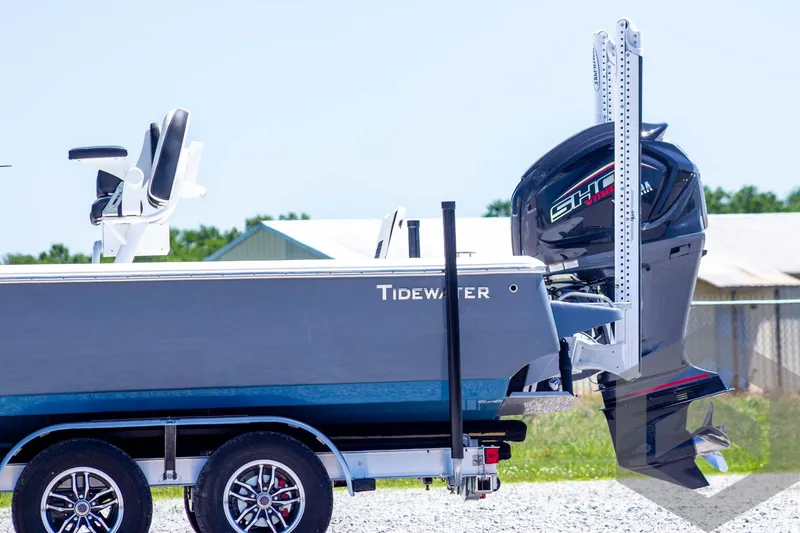 Slide: The Image of 2025 Tidewater 2410 Bay Max boat on trailer with outboard motor, side view. - 10