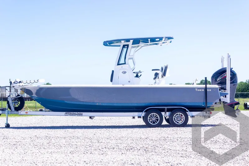 Slide: The Image of 2025 Tidewater 2410 Bay Max boat on trailer, side view, outdoors. - 12