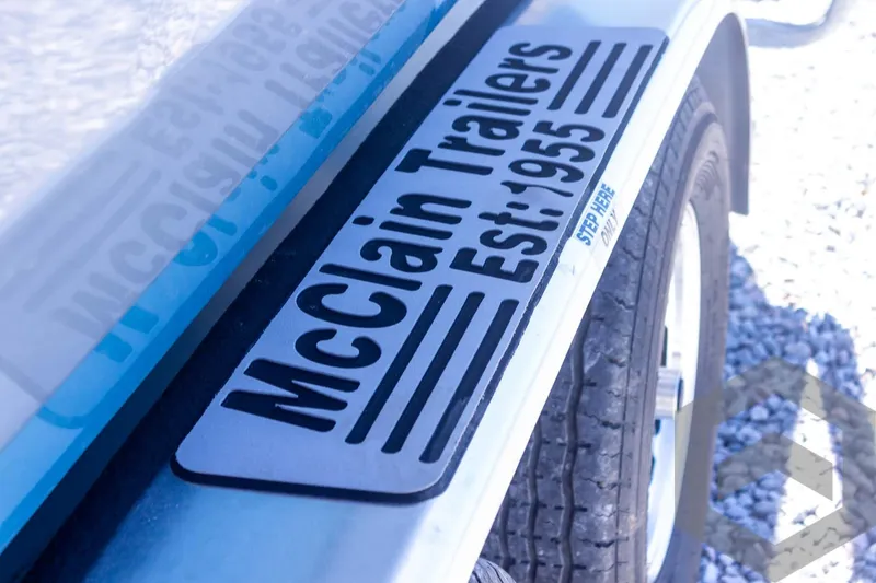 Slide: The Image of McClain Trailers logo on a 2025 Tidewater 2410 Bay Max trailer. - 19