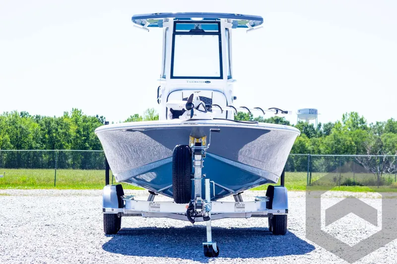 Slide: The Image of 2025 Tidewater 2410 Bay Max boat on trailer, front view, outdoors. - 2