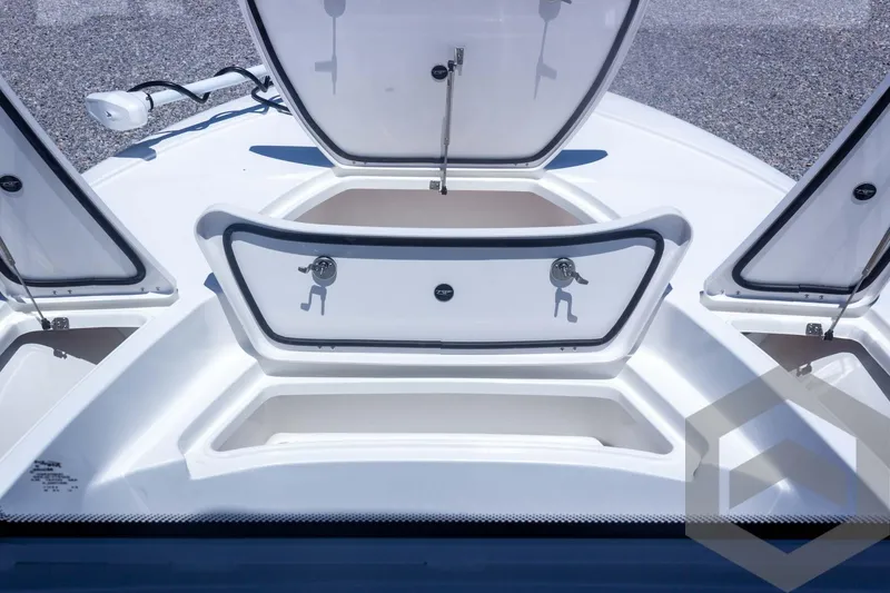 Slide: The Image of 2025 Tidewater 2410 Bay Max boat storage compartments open on deck. - 20