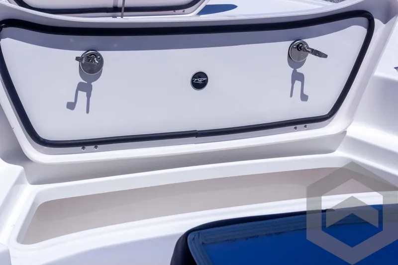 Slide: The Image of 2025 Tidewater 2410 Bay Max boat storage compartment with secure latches and sleek design. - 22