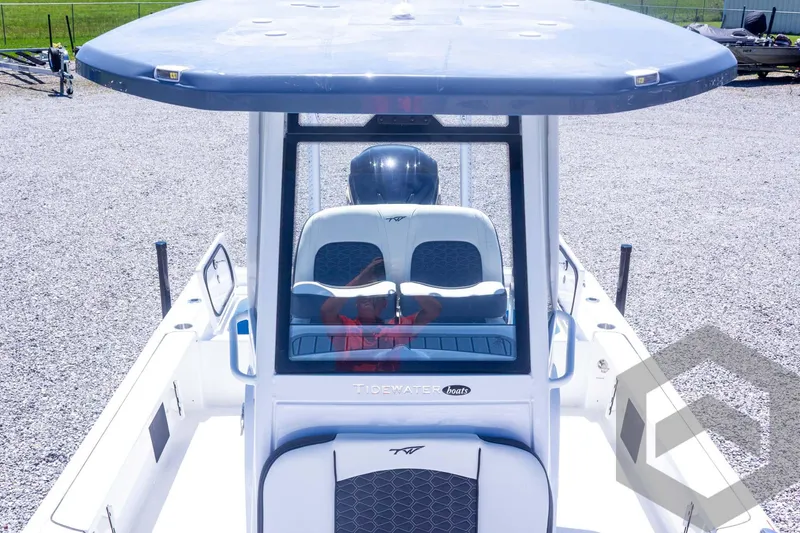 Slide: The Image of 2025 Tidewater 2410 Bay Max boat with T-top, viewed from above on gravel surface. - 28