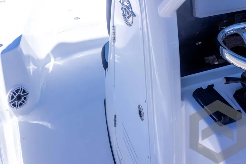 Slide: The Image of 2025 Tidewater 2410 Bay Max boat interior with sleek white design and modern steering console. - 29