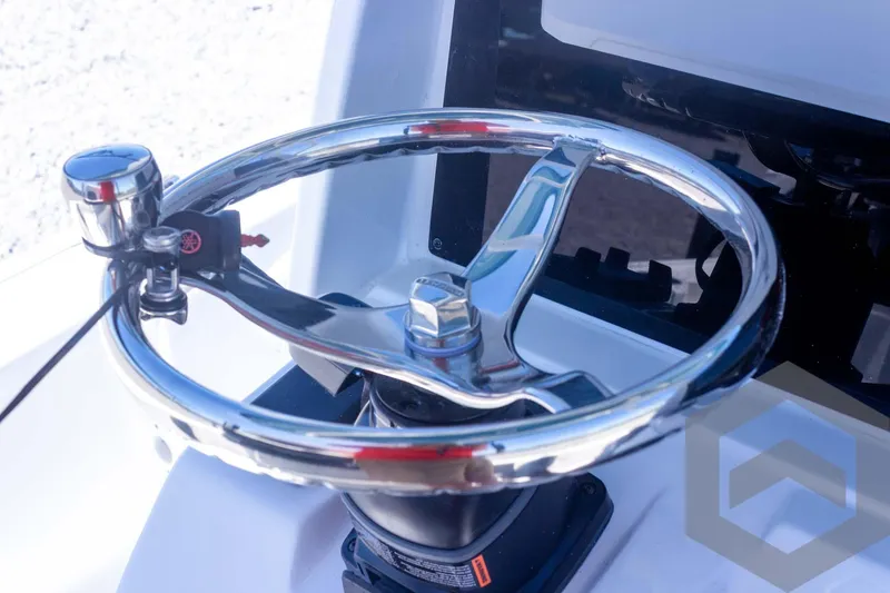 Slide: The Image of 2025 Tidewater 2410 Bay Max steering wheel, chrome finish, close-up view. - 36