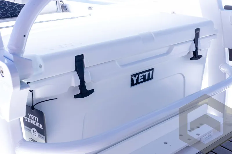Slide: The Image of YETI cooler on 2025 Tidewater 2410 Bay Max boat, featuring durable design and secure latches. - 38