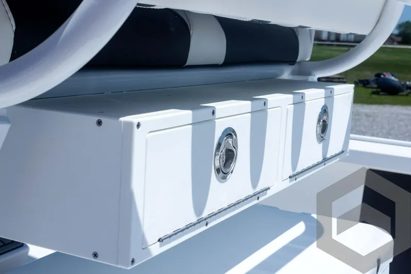 Slide: The Image of 2025 Tidewater 2410 Bay Max boat storage compartments, featuring sleek design and secure latches. - 46