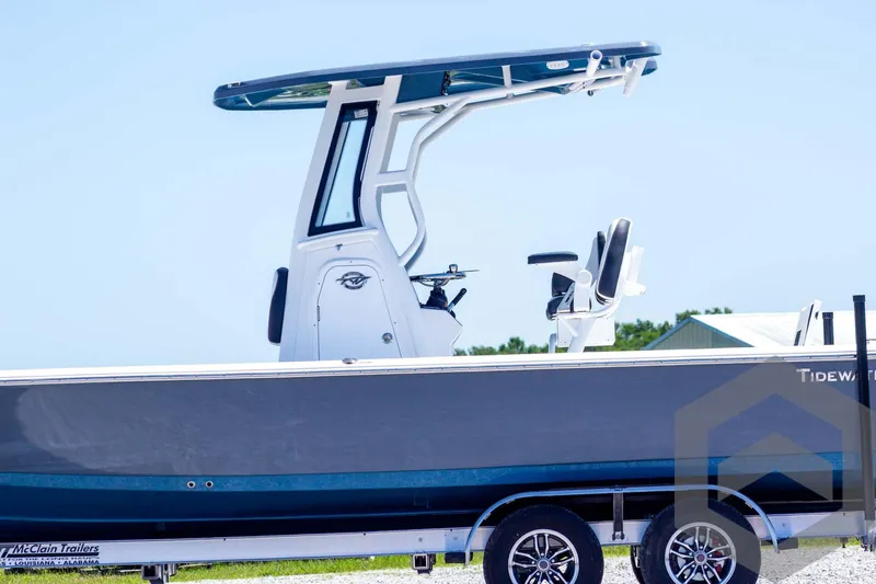 Slide: The Image of 2025 Tidewater 2410 Bay Max boat on trailer, featuring sleek design and modern T-top. - 9