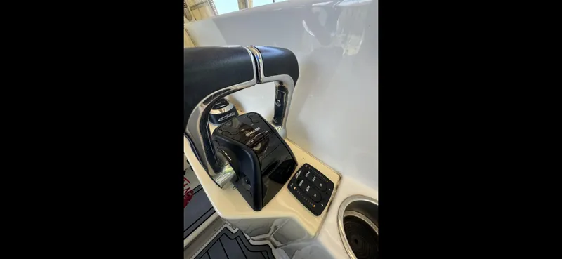 Slide: The Image of 2019 Regal 33 SAV boat throttle controls and dashboard detail. - 11