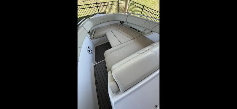 Slide: The Image of 2019 Regal 33 SAV boat interior with beige seating and sleek design. - 16