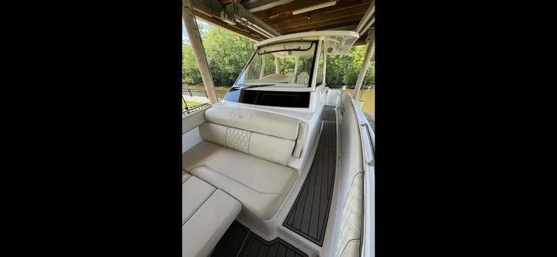 Slide: The Image of 2019 Regal 33 SAV boat interior with white seating and sleek design. - 17