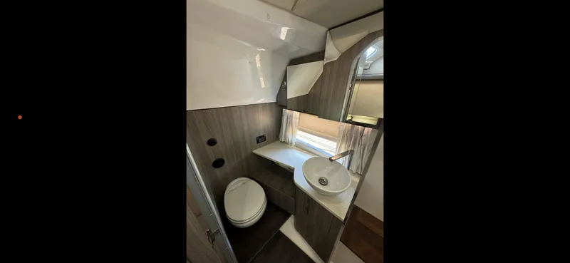 Slide: The Image of 2019 Regal 33 SAV bathroom interior with modern fixtures and compact design. - 30