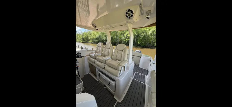 Slide: The Image of 2019 Regal 33 SAV boat interior with plush seating and sleek design. - 7