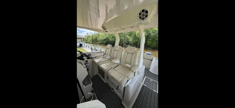 Slide: The Image of 2019 Regal 33 SAV boat interior with plush seating and modern design. - 8