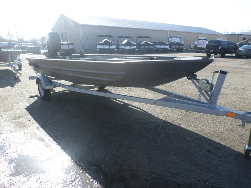 Slide: The Image of 2025 Alweld 1856 VV Marsh boat on trailer in outdoor dealership lot. - 3