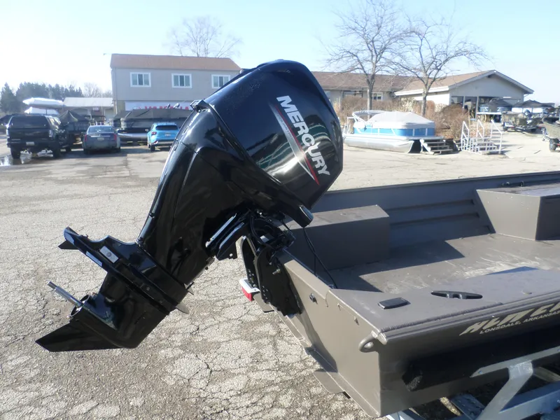Slide: The Image of 2025 Alweld 1856 VV Marsh boat with Mercury outboard motor in a parking lot. - 5