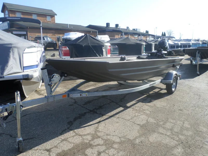 Slide: The Image of 2025 Alweld 1648 VV Marsh boat on trailer in outdoor showroom. - 5