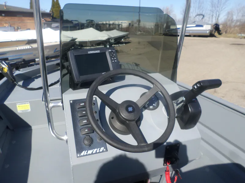 Slide: The Image of 2023 Alweld 1760 VV Marsh boat dashboard with steering wheel and navigation system. - 5