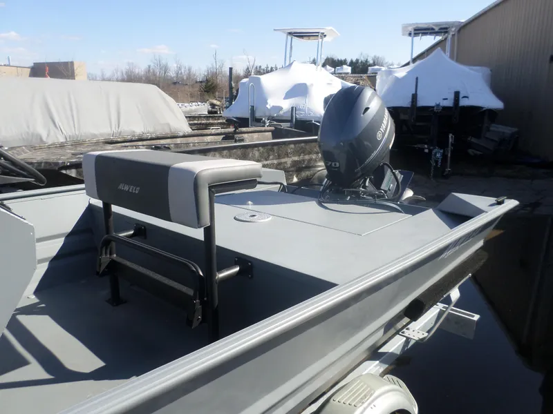 Slide: The Image of 2023 Alweld 1760 VV Marsh boat with Yamaha outboard motor, parked outdoors. - 6