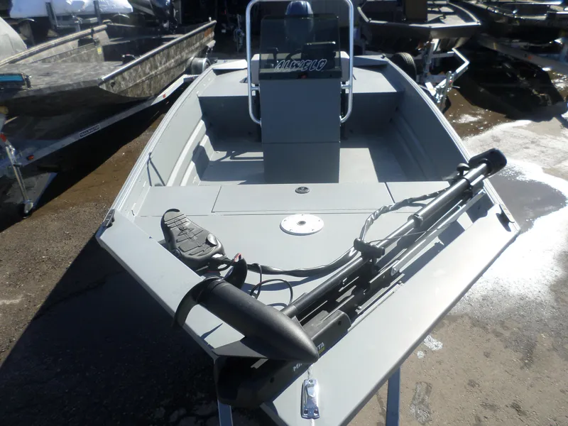 Slide: The Image of 2023 Alweld 1760 VV Marsh boat with trolling motor, parked on a trailer. - 8