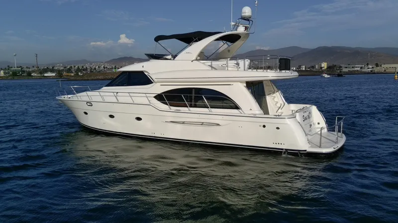 Slide: The Image of 2004 Meridian 580 Pilothouse yacht cruising on calm waters. - 10