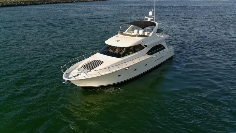 Slide: The Image of 2004 Meridian 580 Pilothouse yacht cruising on open water. - 14