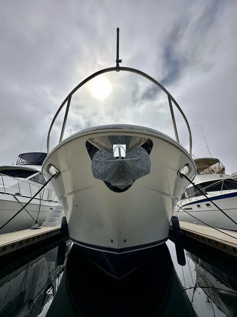 Slide: The Image of 2004 Meridian 580 Pilothouse yacht docked under cloudy sky. - 21