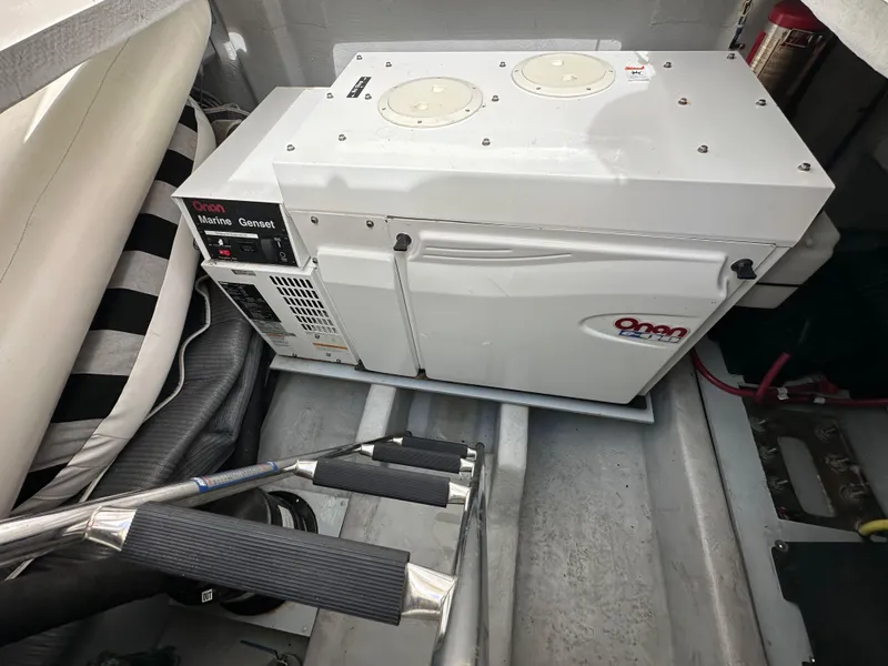 Slide: The Image of 2004 Meridian 580 Pilothouse engine room with Onan marine generator. - 30