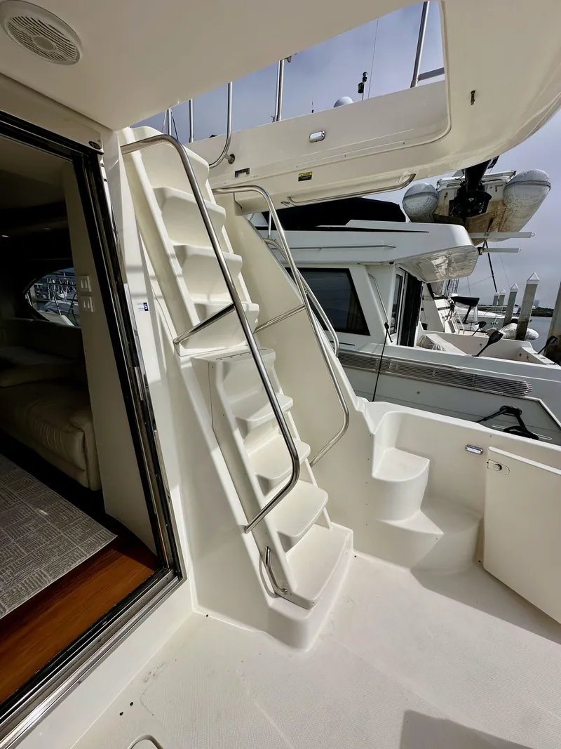 Slide: The Image of Staircase on 2004 Meridian 580 Pilothouse yacht, leading to upper deck. - 33
