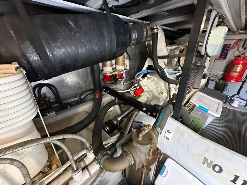 Slide: The Image of Engine room of 2004 Meridian 580 Pilothouse with visible components and fire extinguisher. - 40