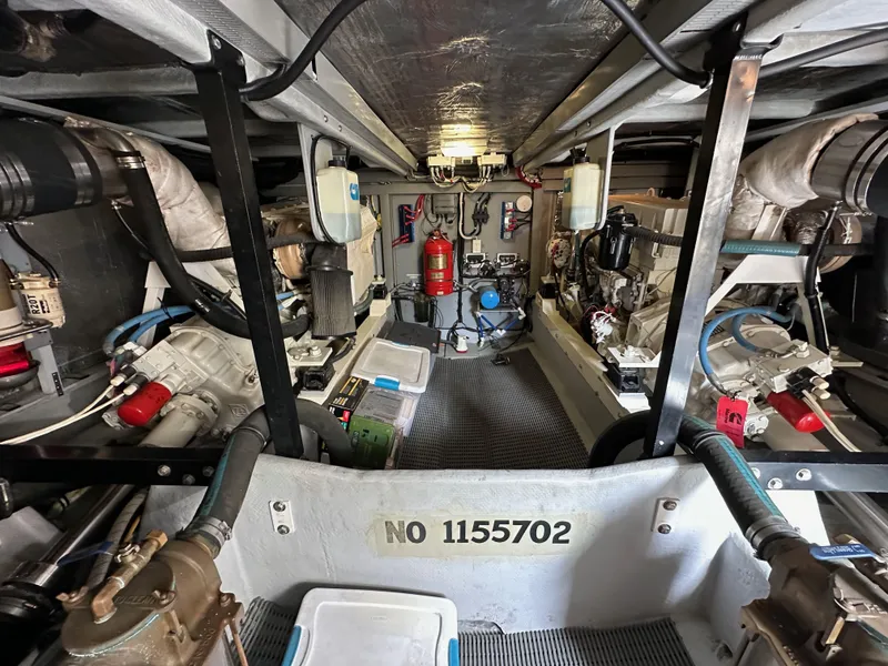 Slide: The Image of Engine room of a 2004 Meridian 580 Pilothouse yacht, showcasing mechanical components and equipment. - 41