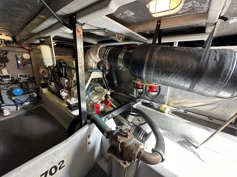 Slide: The Image of Engine room of a 2004 Meridian 580 Pilothouse yacht, showcasing mechanical components. - 42