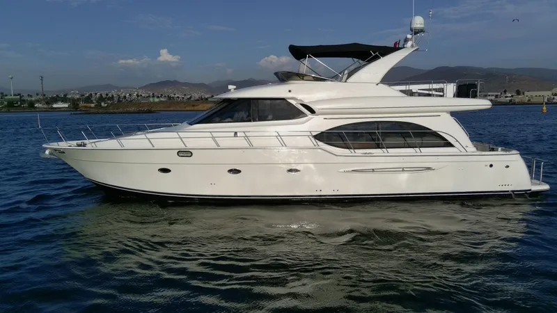 Slide: The Image of 2004 Meridian 580 Pilothouse yacht cruising on calm waters. - 9