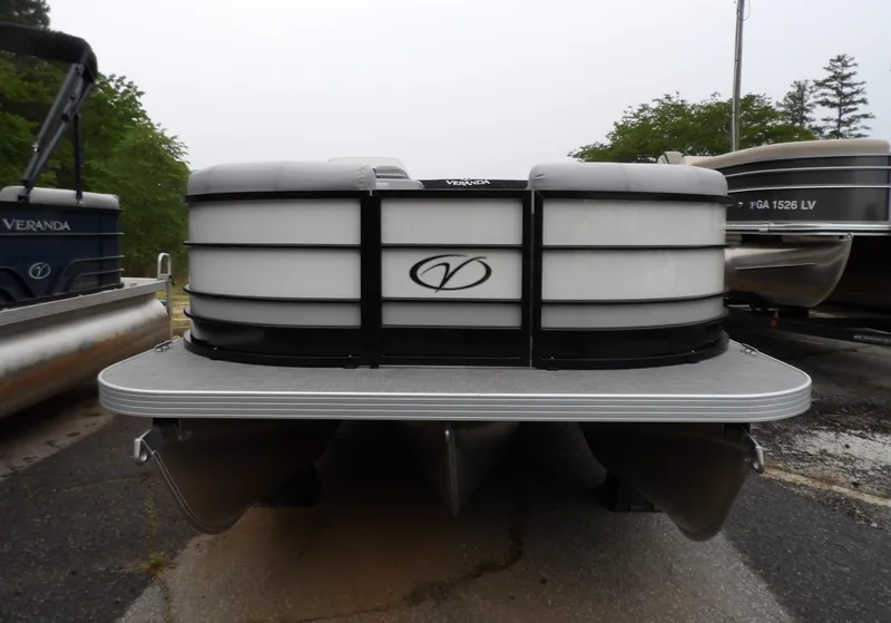Slide: The Image of 2025 Veranda Vista Sport 22RC pontoon boat, front view, parked outdoors. - 10