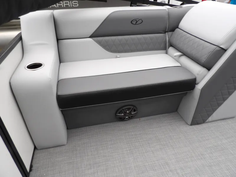 Slide: The Image of 2025 Veranda Vista Sport 22RC boat interior with gray seating and cup holder. - 17
