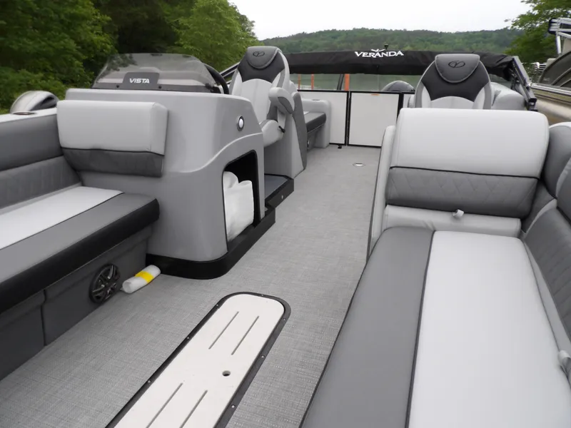 Slide: The Image of 2025 Veranda Vista Sport 22RC pontoon boat interior with gray seating and modern design. - 4
