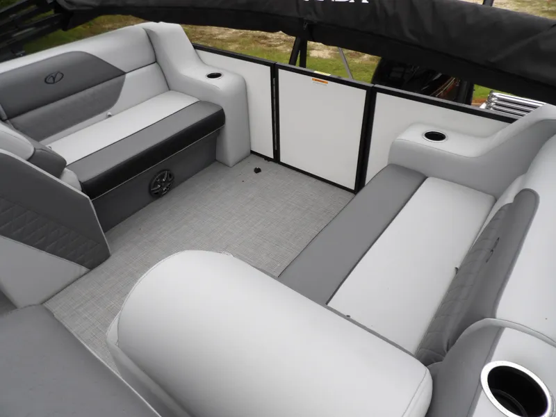 Slide: The Image of 2025 Veranda Vista Sport 22RC interior with gray seating and cup holders. - 6