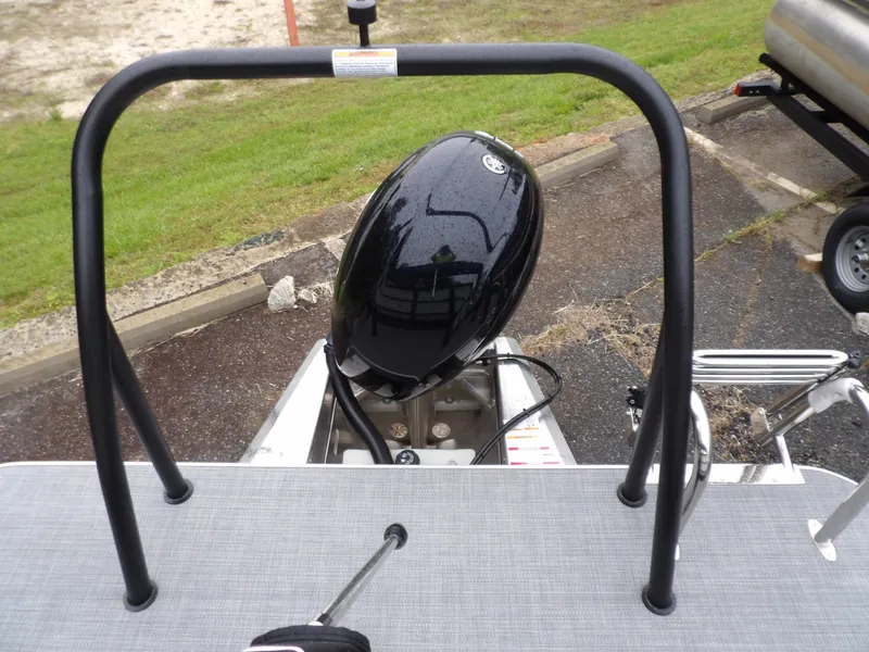 Slide: The Image of 2025 Veranda Vista Sport 22RC boat with outboard motor and safety rail. - 7