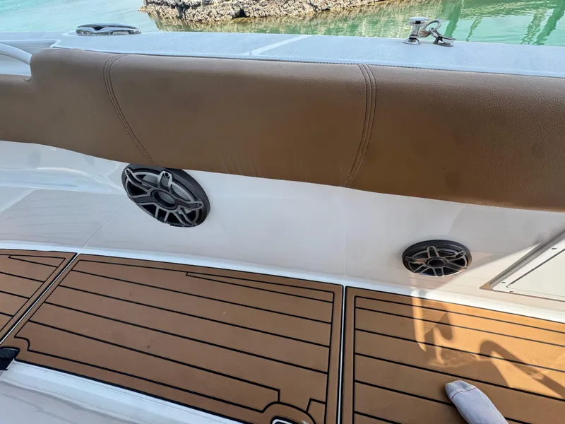 Slide: The Image of 2020 Sea Hunt Gamefish 30 boat interior with brown seating and wood-style flooring. - 18
