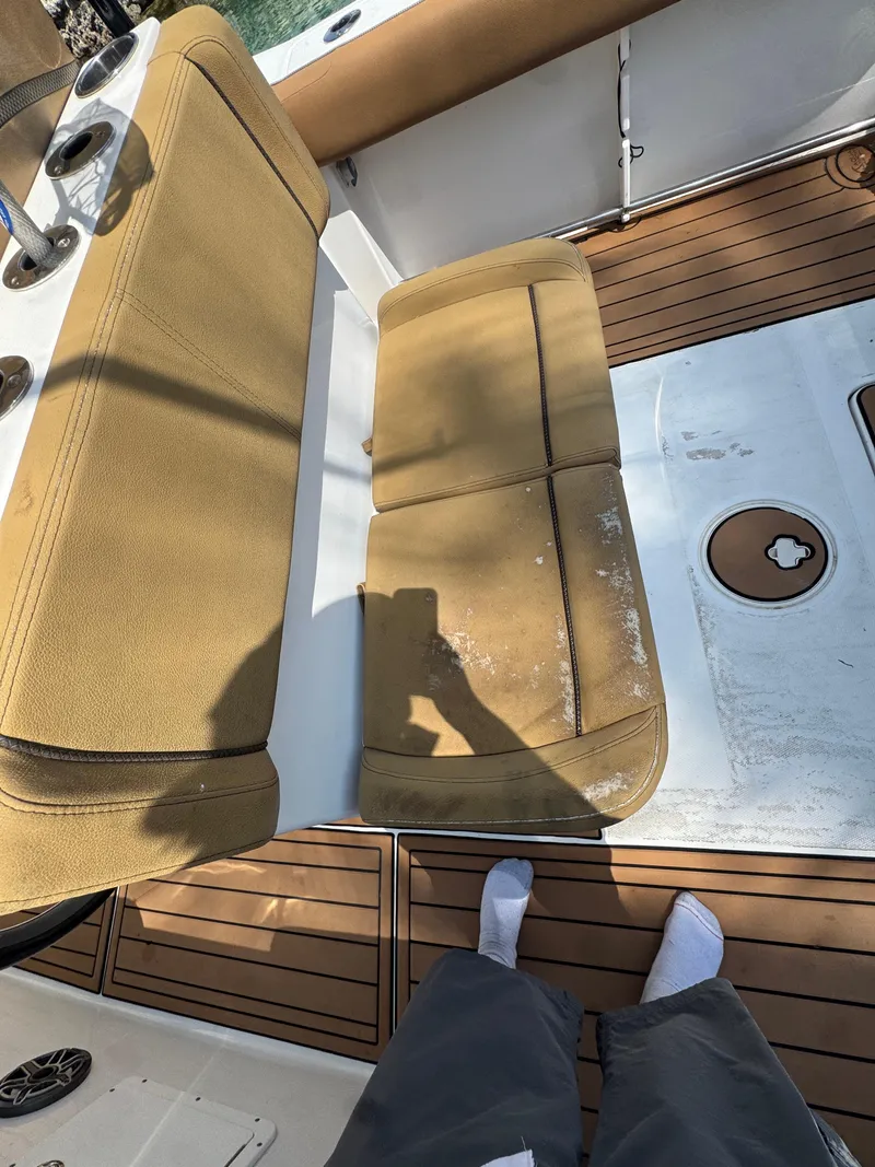 Slide: The Image of 2020 Sea Hunt Gamefish 30 Forward Seating with tan cushions and teak flooring. - 19