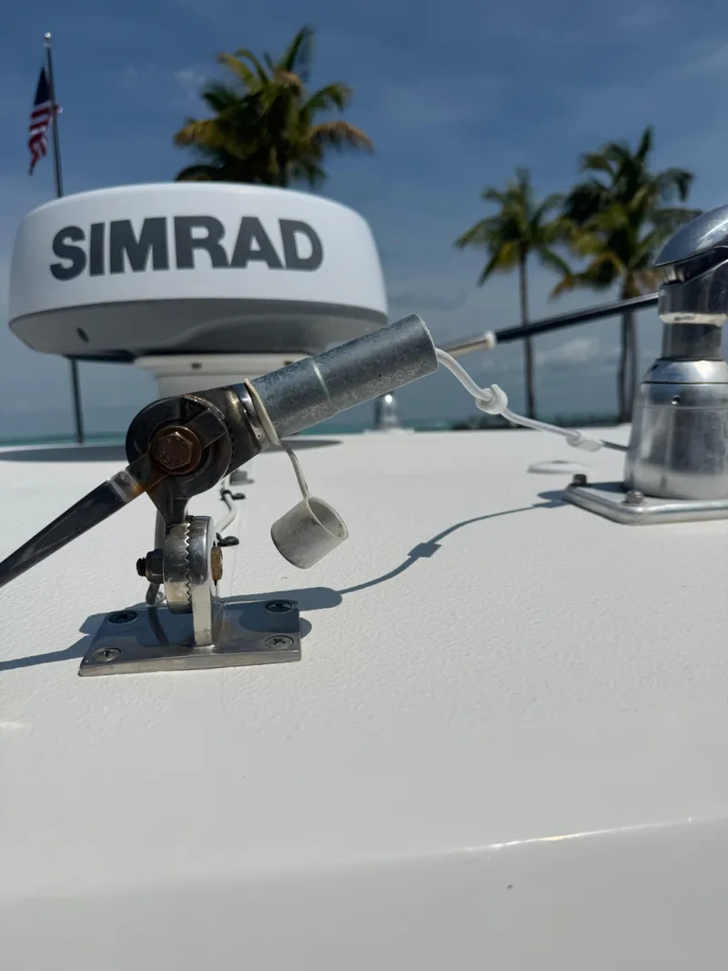 Slide: The Image of 2020 Sea Hunt Gamefish 30 boat with Simrad radar, palm trees in background. - 24
