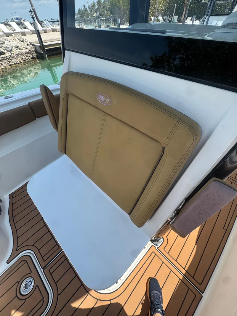 Slide: The Image of 2020 Sea Hunt Gamefish 30 boat with forward seating and teak flooring. - 32